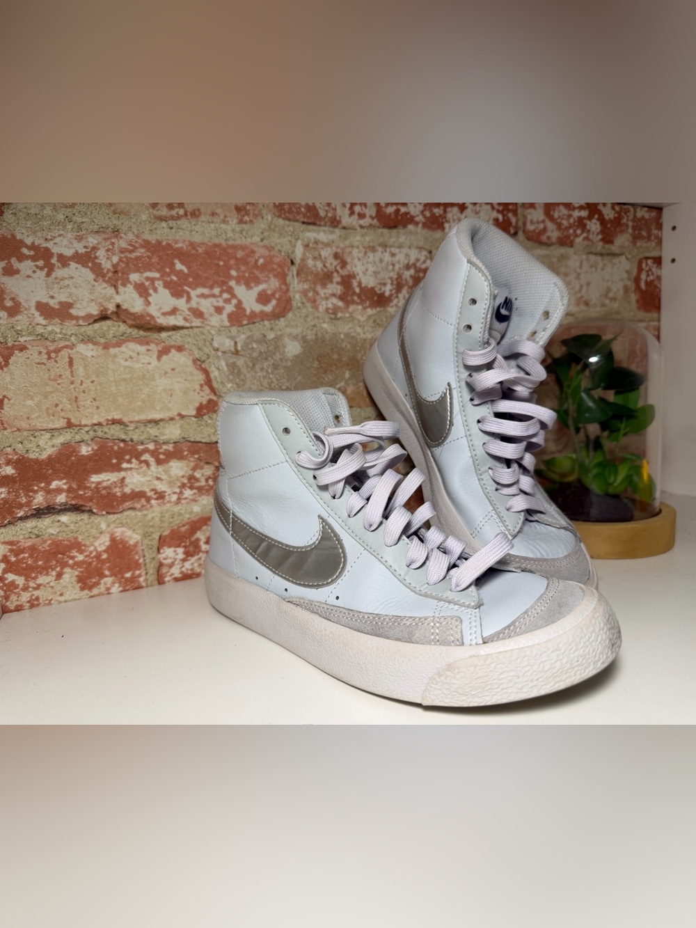 Nike Women's White High-Top Sneakers with Metallic Silver Swoosh